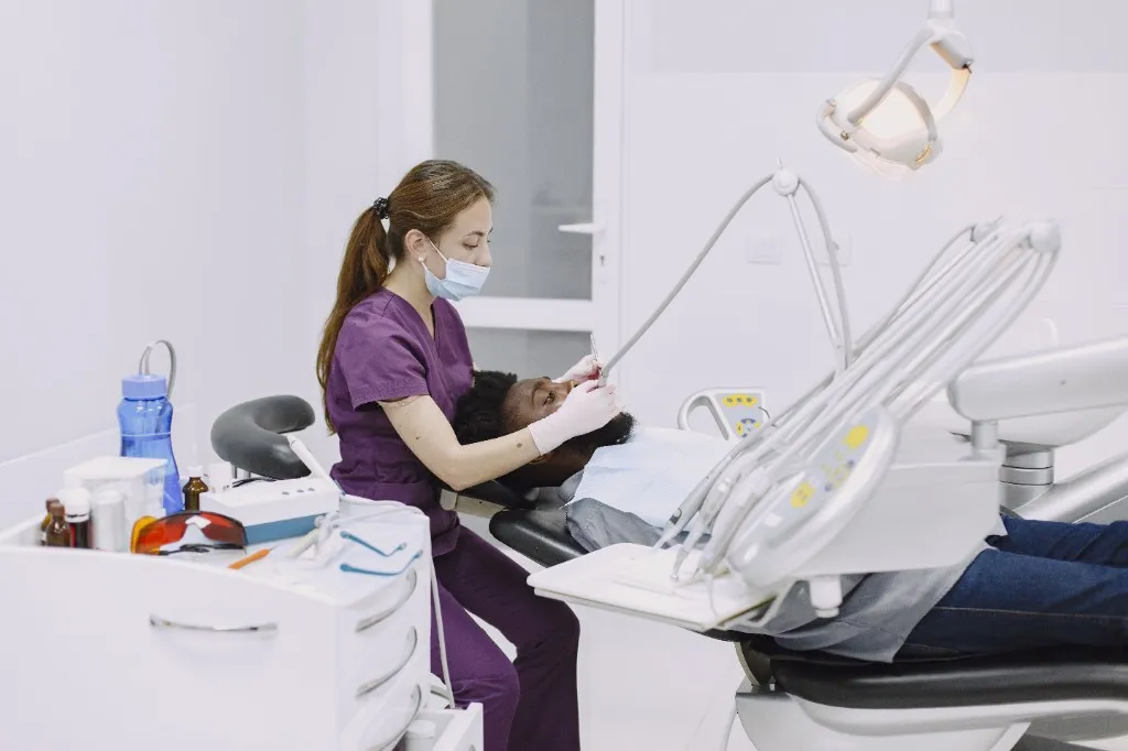 Dentist treating a patient at Smile Bright Westlands